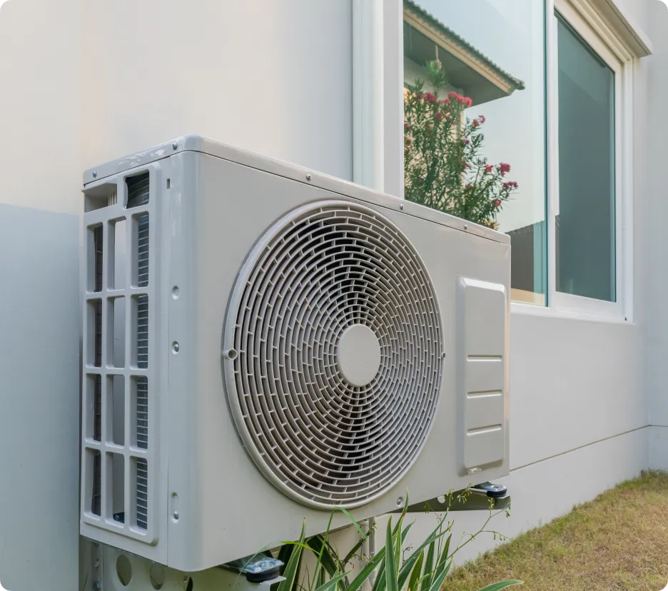 Home with heat pump and solar panels showing electrification upgrades