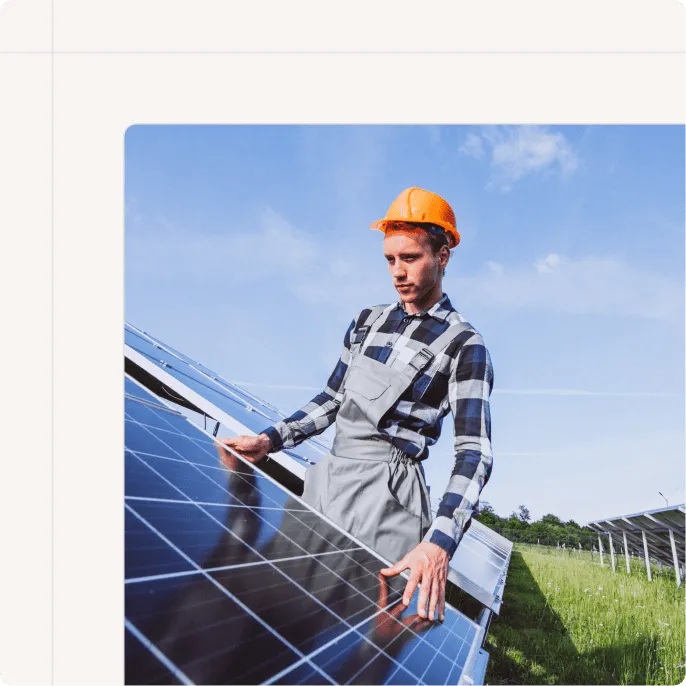 A man fitting a solar panel
